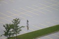 Lone Pedestrian in Empty Wet P Royalty Free Stock Photo