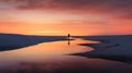 a lone person stands on the beach at sunset