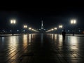 a lone person stands in the middle of an empty street at night