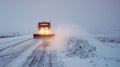 A lone plow truck rumbles down the deserted roads its bright flashing lights illuminating the thick blanket of snow that Royalty Free Stock Photo