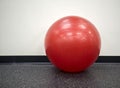 lone red exercise ball in the gym