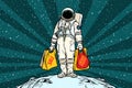 Lone retro astronaut with a sale shopping bags Royalty Free Stock Photo