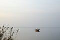 Lone rowing boat in calm water Royalty Free Stock Photo