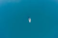 A lone sailboat at anchorage. Aerial view.