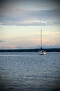 Lone Sailboat with Evening Light On the River Royalty Free Stock Photo