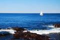 A lone sailboat on the sea