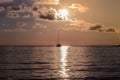 lone sailboat on the high sea at sunset Royalty Free Stock Photo