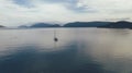 Lone sailboat at sea