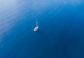 A lone sailing boat at anchor. The view from the air. Royalty Free Stock Photo