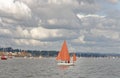 Starcross, devon: sailing boat with dark orange sails