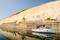 Lone sailing boat in marina