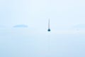 Lone sailing boat at the ocean