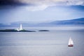 A lone sailing ship sailing to Isle of Harris