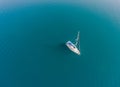 A lone sailing vessel at anchorage.