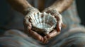 A lone seashell serving as a makeshift meditation object held in the meditators hands Royalty Free Stock Photo