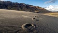 Trail of Footprints in a Desolate Volcanic Desert Royalty Free Stock Photo