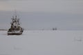 A lone ship in a snowy sea