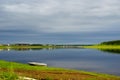 A lone small boat stands on the shore of the Northern Yakut river vilyu near the village of ulus Suntar.