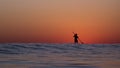 Lone Stand up Paddler on the Ocean at Sunset Royalty Free Stock Photo