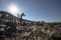 Lone stone man of Kaokoland walking to a gathering at Marble. Kunene Region, Namibia.