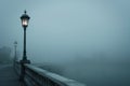 lone streetlamp on bridge with enveloping fog Royalty Free Stock Photo