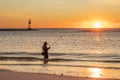 A lone surf-fisherman gets ready to cast at dawn at the north end of Long Beach Island Royalty Free Stock Photo