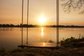 Lone swing at river side and sunset ,Thailand Royalty Free Stock Photo