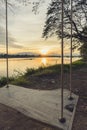 Lone swing at river side and sunset ,Thailand . Vintage Tone. Royalty Free Stock Photo