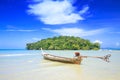 A lone tailboat waits by the shore Royalty Free Stock Photo