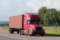 Lone tractor-trailer on an interstate highway.