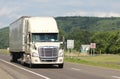 Lone tractor-trailer on an interstate highway. Royalty Free Stock Photo