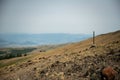 Lone Trail Marker Along Specimen Ridge With The Real Trail and Two Animal Trails On The Distant Hill Side Royalty Free Stock Photo