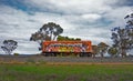 Lone train carriage on railway siding in rural Victoria, covered in graffiti.