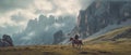 lone traveler on a horse in the plain against the backdrop of mountains. Royalty Free Stock Photo