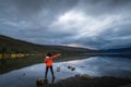 Lone traveler and lake scene Royalty Free Stock Photo