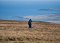 A lone walker on the boardwalk at Hermaness on the island of Unst in Shetland, Scotland, UK.