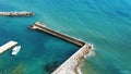 A lone white boat moored at the sea on a Sunny day. Pier with access to the blue sea Royalty Free Stock Photo