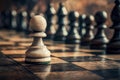 A lone white pawn is juxtaposed with a collection of dark chess pieces Royalty Free Stock Photo