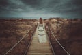 Lone woman in front of dramatic cloudscape