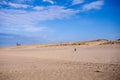 Lone woman hiker on the beach, walks alone in the sand on Cape Cod National Seashore in Provincetown Royalty Free Stock Photo