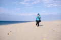 Lone woman hiker on Race Point beach, walks alone in the sand on Cape Cod National Seashore in Provincetown Royalty Free Stock Photo