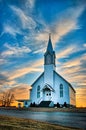 Ellis County, KS USA - A Lone Wooden Church at Dusk with Sunset Clouds in Kansas American Midwest Prairie Royalty Free Stock Photo