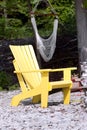 Lone yellow adirondack chair Royalty Free Stock Photo