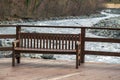 Loneliness concept, empty bench by the river Royalty Free Stock Photo