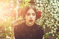 Loneliness. Cute girl with white flower in mouth on thoughtful face Royalty Free Stock Photo