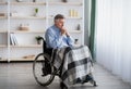 Loneliness of disabled senior people at retirement home. Handicapped elderly man in wheelchair suffering from depression Royalty Free Stock Photo