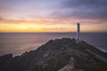 A lonely lightouse watching the sunset.