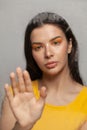 Loneliness, sadness and mental health disorder concept. Woman behind a wet glass Royalty Free Stock Photo