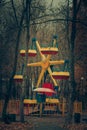 Lonely abandoned carousel attraction in the autumn park