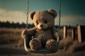 Lonely abandoned old teddy bear on swing with rusty chains